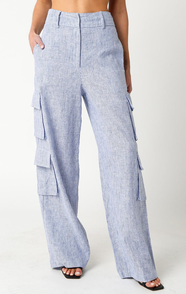 Hadley Linen Cargo Pants Blue. These linen cargo pants feature a high waist and cargo pockets throughout for a cool mix of preppy and trendy perfect for adding a touch of newness to your closet.