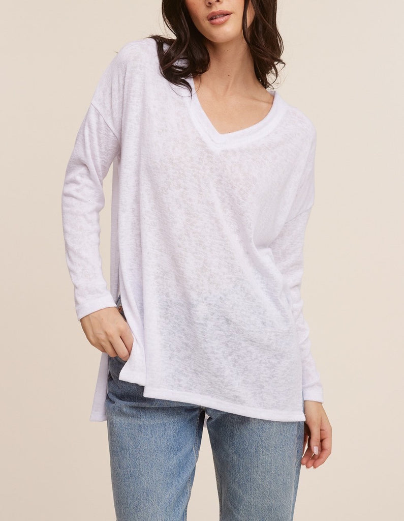 Raquel V-Neck Long Sleeve Top White. This ultra lightweight long sleeve top features a v-neckline and side slit detail, the oversized fit make it perfect for throwing on with leggings for an easy outfit.