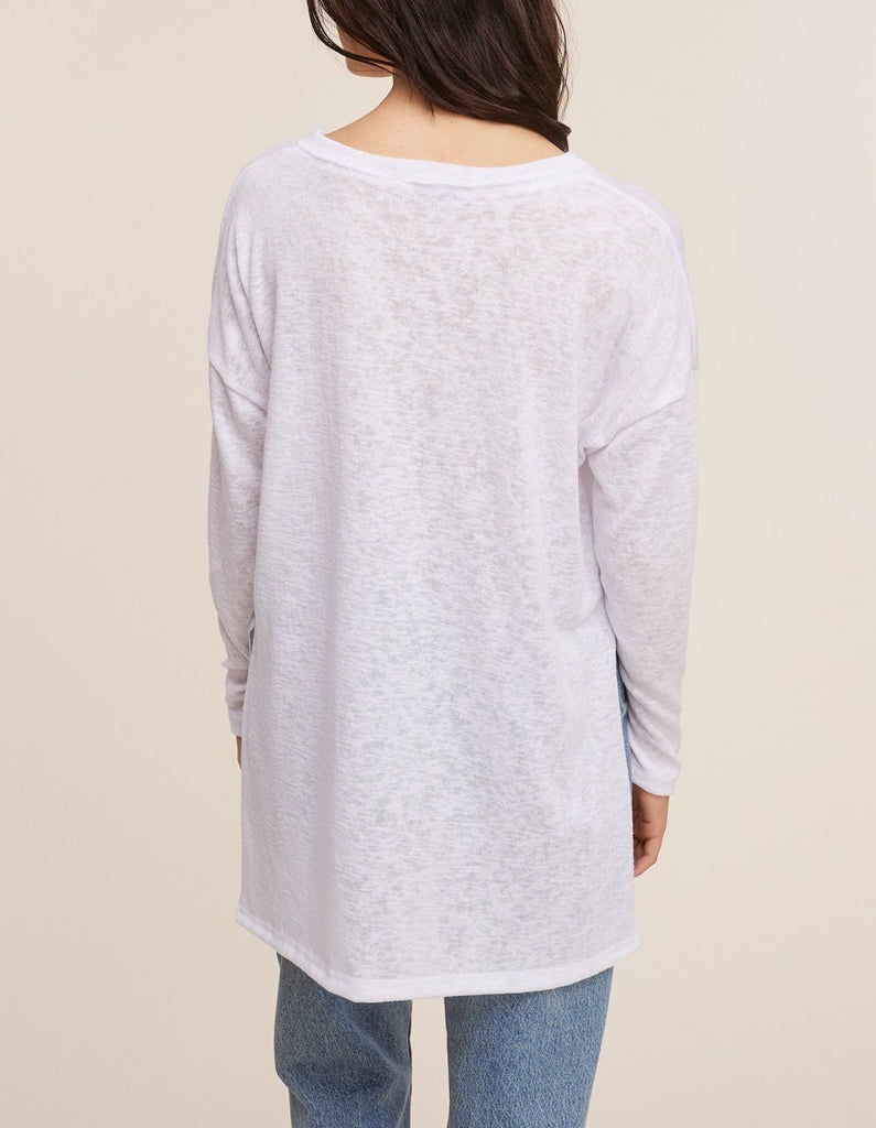 Raquel V-Neck Long Sleeve Top White. This ultra lightweight long sleeve top features a v-neckline and side slit detail, the oversized fit make it perfect for throwing on with leggings for an easy outfit.