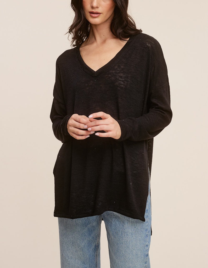 Raquel V-Neck Long Sleeve Top Black. This ultra lightweight long sleeve top features a v-neckline and side slit detail, the oversized fit make it perfect for throwing on with leggings for an easy outfit.