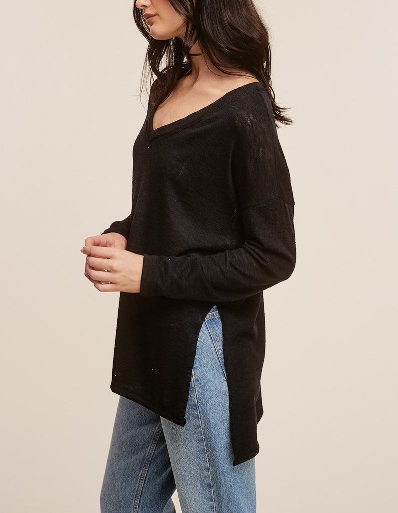 Raquel V-Neck Long Sleeve Top Black. This ultra lightweight long sleeve top features a v-neckline and side slit detail, the oversized fit make it perfect for throwing on with leggings for an easy outfit.