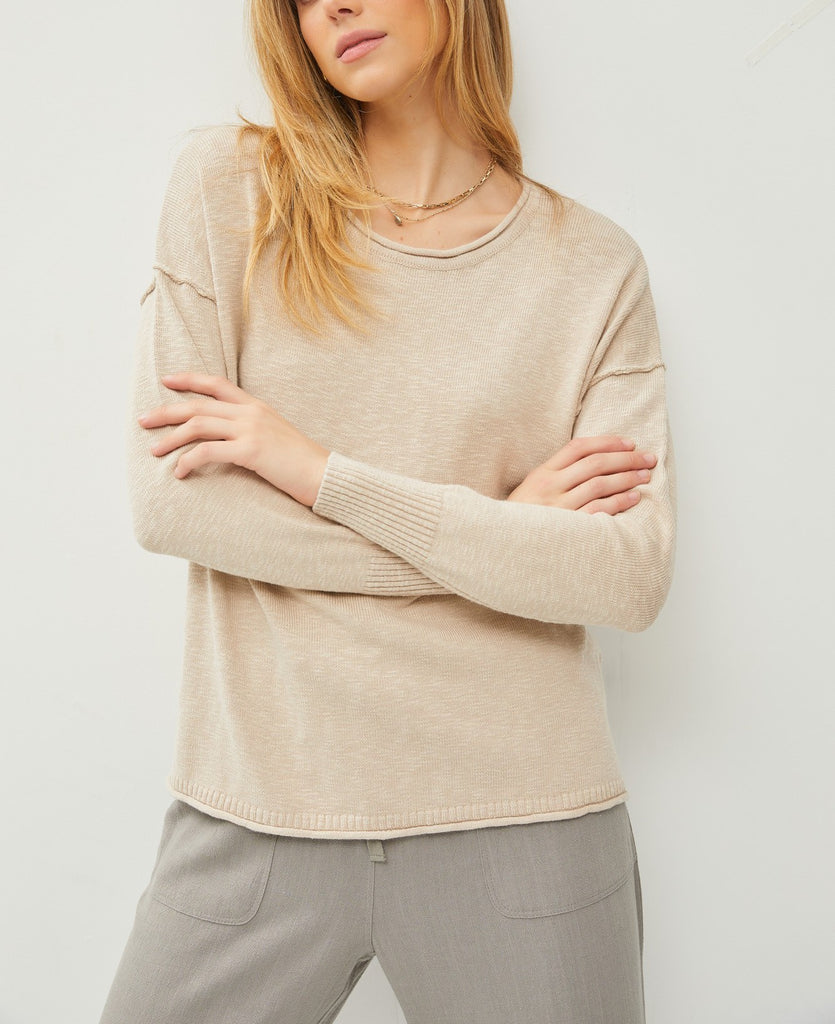 Palmer Drop Shoulder Top Light Taupe. This lightweight drop shoulder top features a relaxed fit and exposed seam details, the perfect everyday piece to wear with jeans or pants when you're on the go.