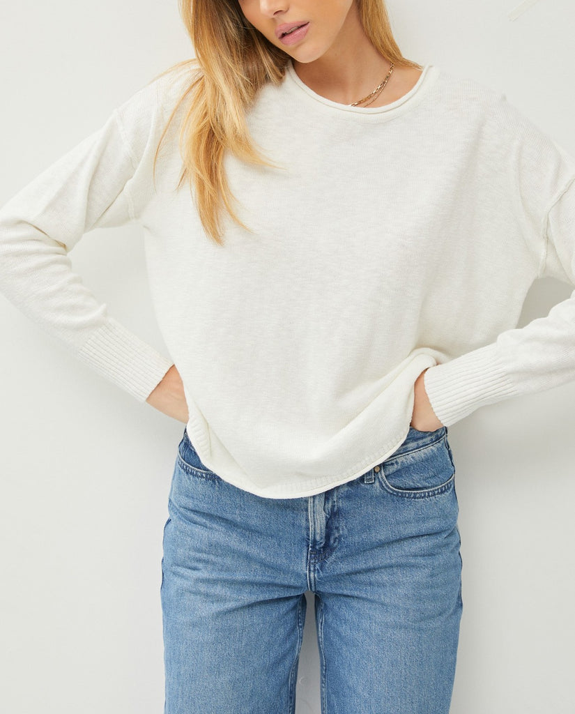 Palmer Drop Shoulder Top Off White. This lightweight drop shoulder top features a relaxed fit and exposed seam details, the perfect everyday piece to wear with jeans or pants when you're on the go.