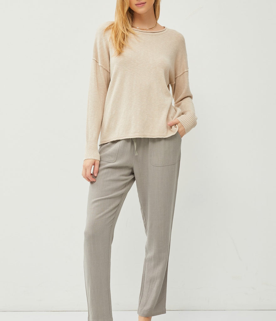 Palmer Drop Shoulder Top Light Taupe. This lightweight drop shoulder top features a relaxed fit and exposed seam details, the perfect everyday piece to wear with jeans or pants when you're on the go.