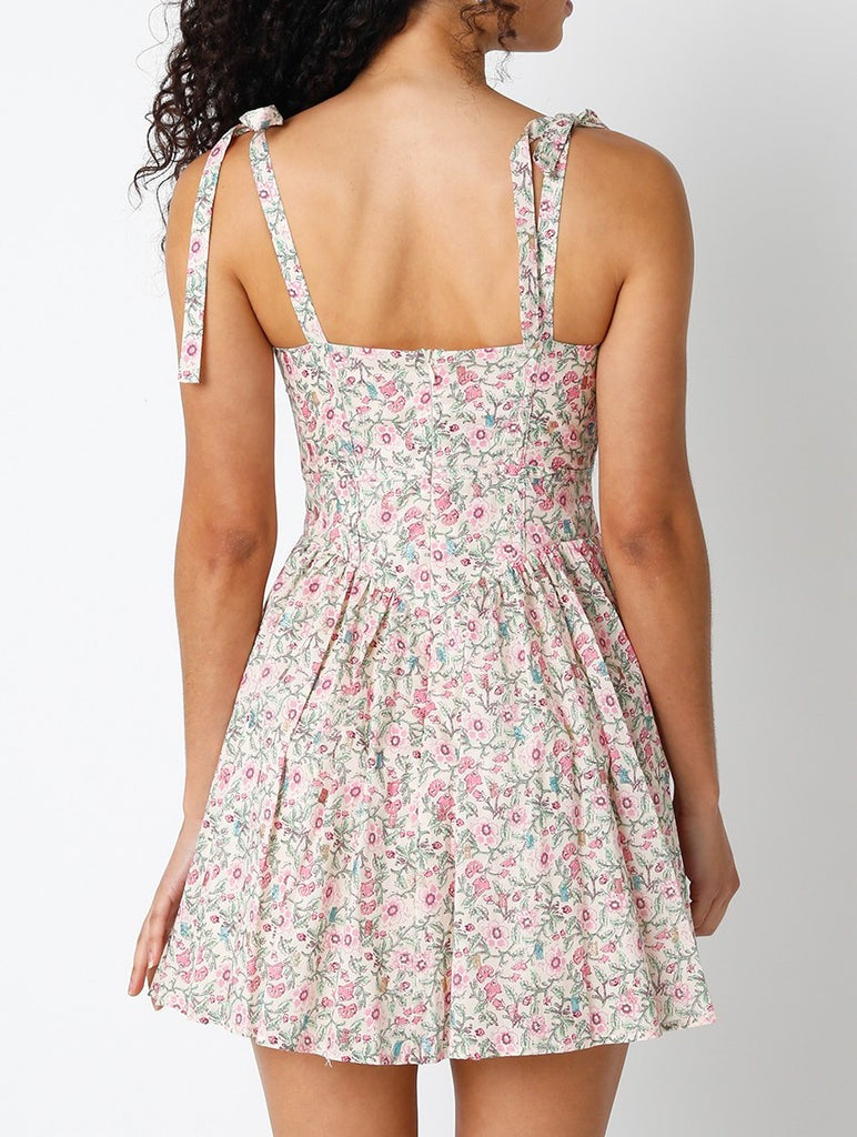 Lin Floral Shoulder Tie Dress Pink Green Floral. This adorable mini dress features a square neckline with front tie detail and ties at the shoulders as well with a zip close back, the perfect dress for everyday.
