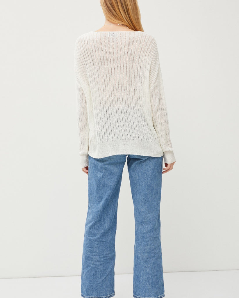 Teagan Sheer Knit Top White. This lightweight knit top features a wide v-neckline and long sleeves, perfect for layering over your fav tank and pairing with jeans.