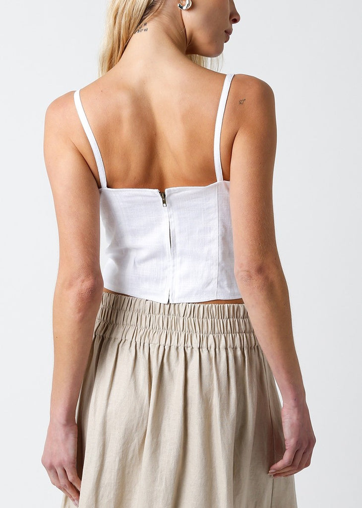 Ladonna Corset Bodice Tank White. This sleeveless corset style top features a square neckline with a zip close back and curved hem, dress it up with a skirt and heels or down with sneakers and jeans.