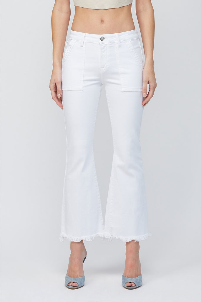 Hidden Happi White Cargo Flare White. These cropped flare jeans feature a fringe bottom hem and front cargo style pockets for the perfect update to your basic white jeans.