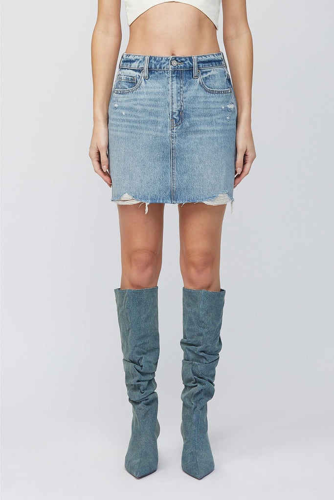 Hidden Peyton Mini Skirt Medium Blue. This classic denim mini is a closet must have for the spring and summer, in a medium blue wash featuring distressed details for a worn in timeless look.