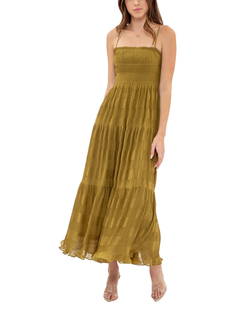 Marielle Tier Pleated Maxi Kiwi. This tiered maxi dress features a pleated design with a square neckline and adjustable straps, the perfect dress for an effortless put together look.