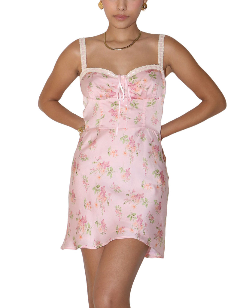 Maisie Floral Lace Trim Mini Dress Rose Pink. This adorable floral print satin mini dress features lace ribbon trim with a bustier style bodice and adjustable straps, perfect for a spring night out.