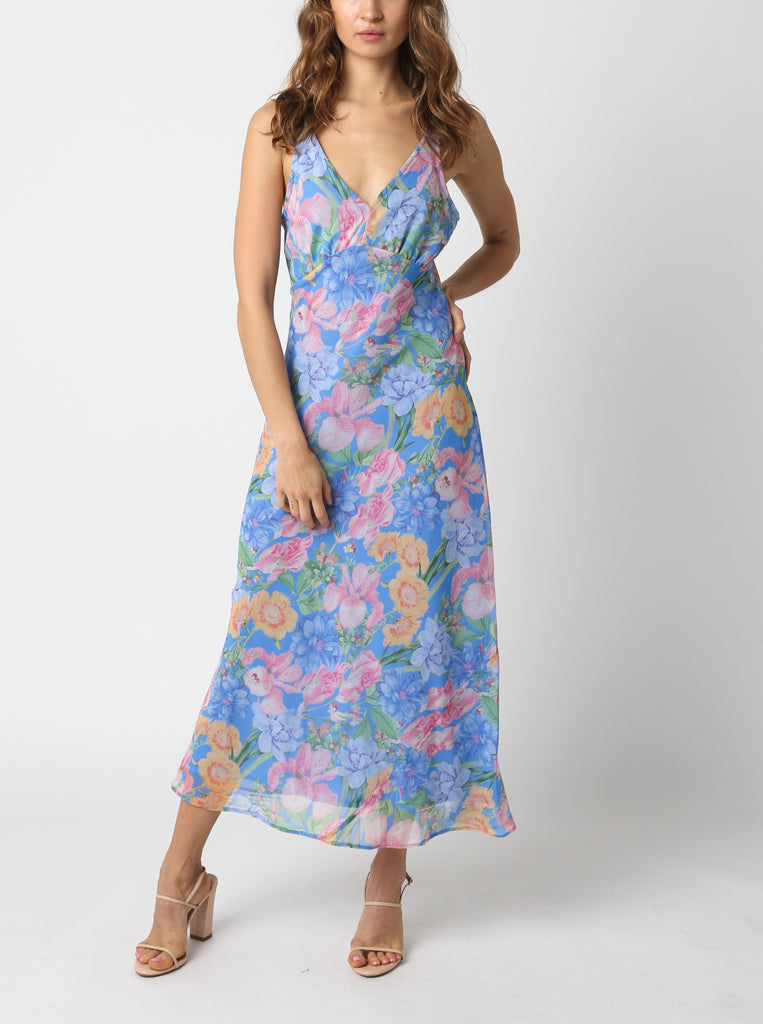 Gillian Floral Midi Dress Blue. This sleeveless midi dress features a v-neckline and a floral print, perfect for a special occasion, it goes perfectly with any heels for a pretty look day or night.