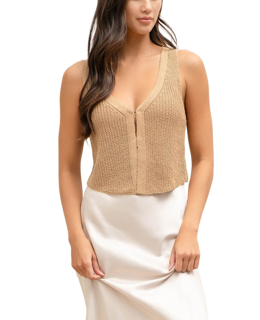 Brooklyn Hook & Eye Knit Vest Tan. This knit vest features a sleeveless design with hook and eye closures and v-neckline, wear it on its own for a bare look or layer it over your favorite tank or tee.