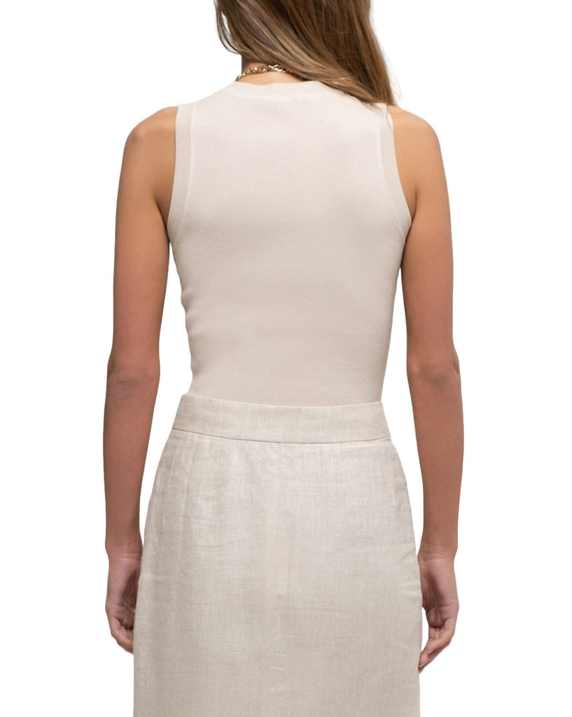 Guilia Round Neck Knit Tank Oatmeal. This fitted knit top features a round neck and sleeveless design perfect for wearing with jeans or shorts for a sophisticated summer look.