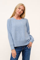 white knit sweater women, classic crewneck sweater, everyday sweater women, neutral knit top, layering sweater women, lightweight knit sweater, wardrobe essentials sweater, casual chic sweater