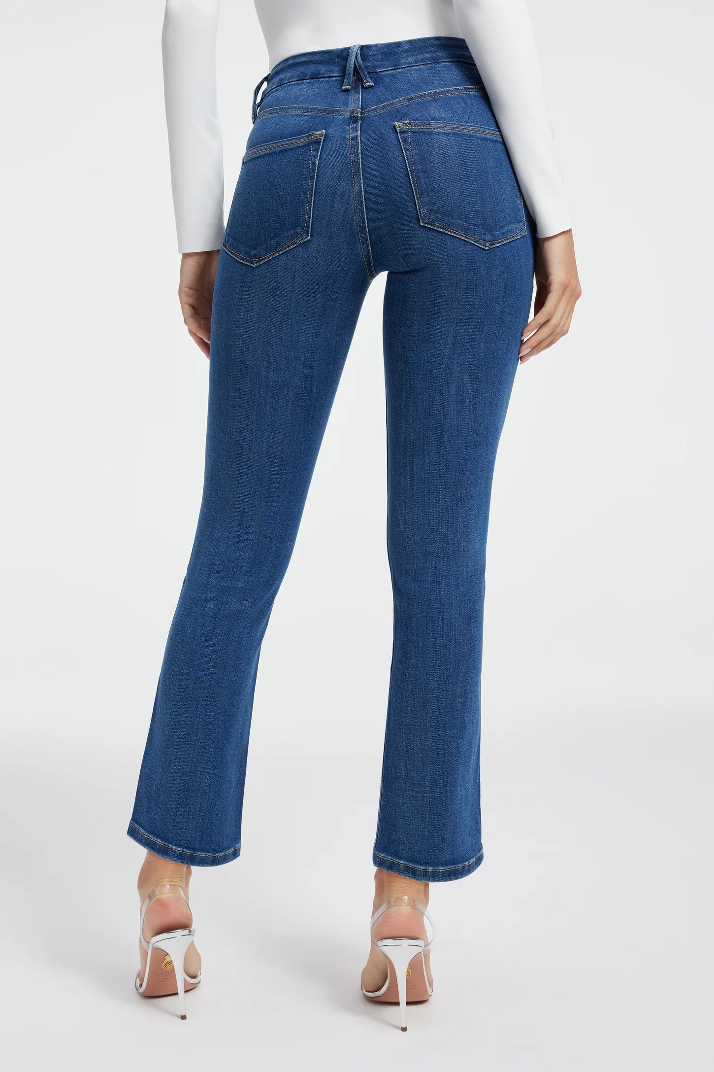 Good American Straight Leg Jeans Blue. The ultimate sculpting jeans, featuring an iconic straight leg fit, these are the body-hugging, booty shaping jeans of your dreams featuring a mid-rise and clean design.