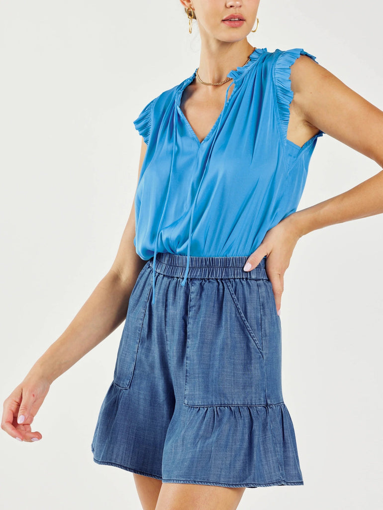 Current Air Denim Wash Skort. This chambray skort is feminine, comfortable, and light enough to wear into the depths of summer. Cut for a relaxed shape, the pair features an elasticized waist and roomy front pockets accented by gentle gathers.