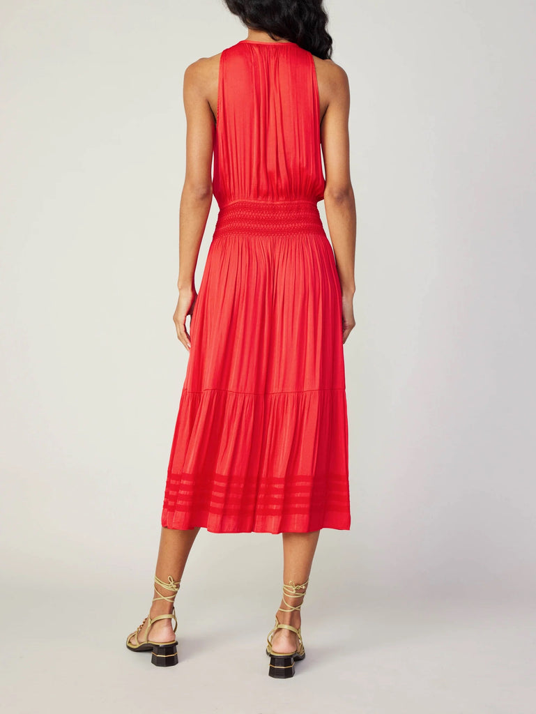 Current Air Halter Key Hole Midi Dress Bright Red. An effortless midi dress that's simple yet stunning. The sleeveless halter style is beautifully gathered at the bodice and smocked at the waist, complete with tonal embroidery. The skirt flows to a shin-skimming tiered hem encircled by tonal chiffon bias tape.