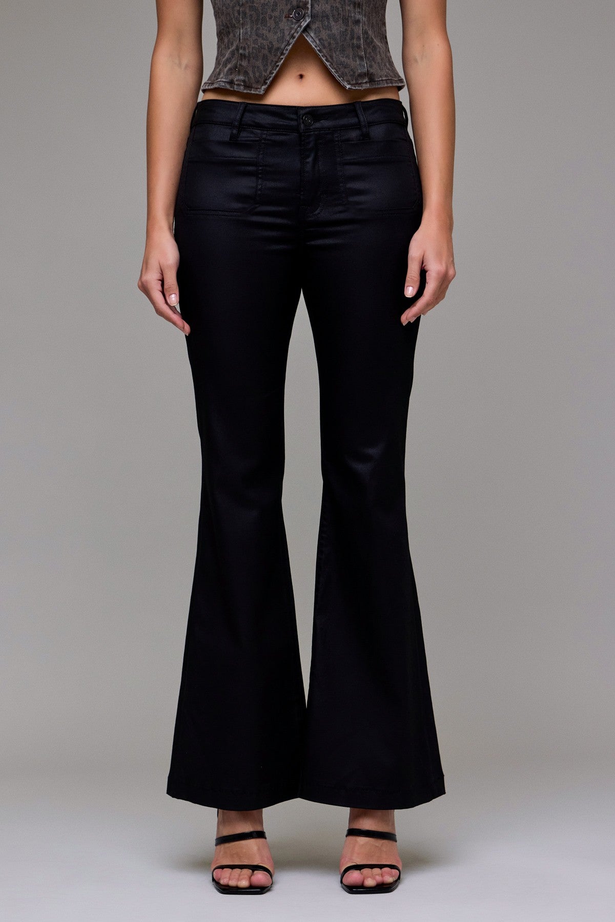 black coated jeans, coated flare jeans, leather look jeans, shiny black denim, women’s coated pants, low rise coated jeans, sleek black jeans, night out denim, coated stretch jeans, dressy black jeans, leather effect jeans, chic coated flare pants