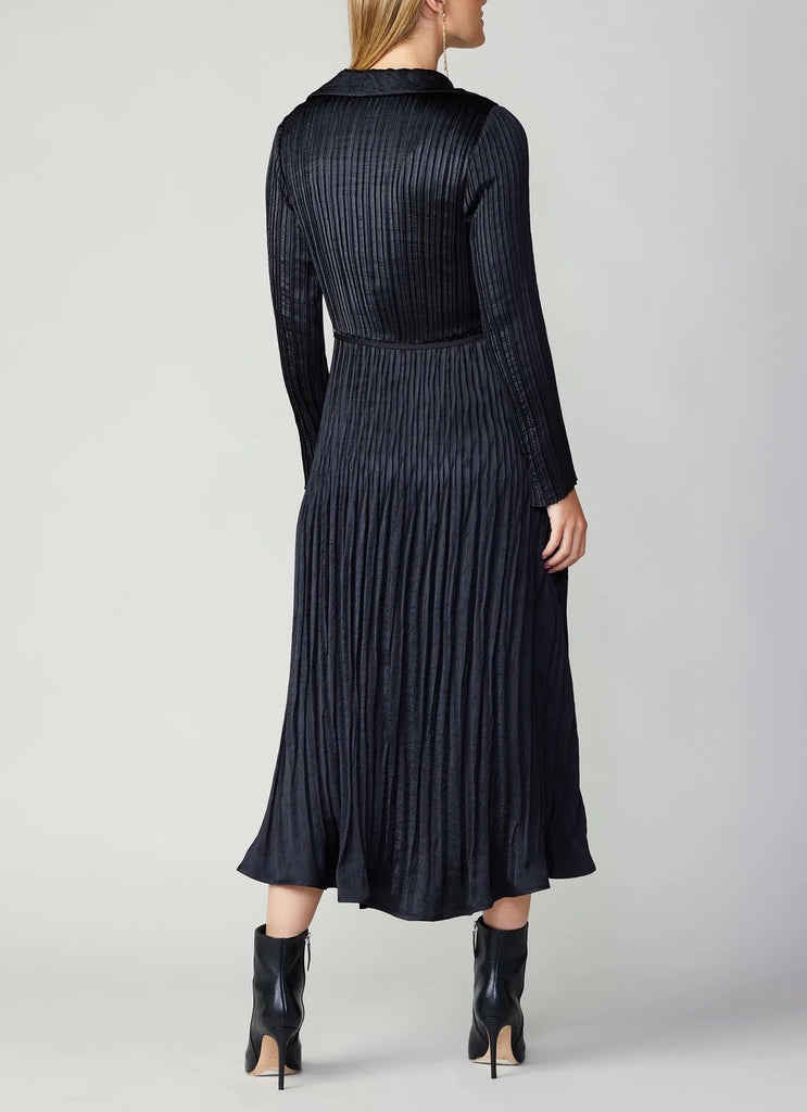 Current Air Pleated Midi Dress Black. This button-up shirt dress has a crinkled texture, soft pleats, and a slender self-tie belt to define the shape. Layer a cardigan or jacket on top to take it into the cooler seasons.