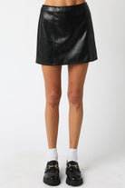 black faux leather mini skirt, women’s leather look skirt, high waist A-line skirt, edgy mini skirt outfit, vegan leather skirt for women, versatile black mini skirt