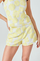 yellow and white floral mesh shorts