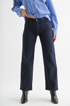 utility jeans women, dark indigo jeans, high rise straight jeans, wide leg denim, front pocket jeans, structured dark wash jeans, modern utility pants, tailored denim trousers, high waist wide leg jeans, dark blue jeans women, elevated casual denim, chic fall jeans