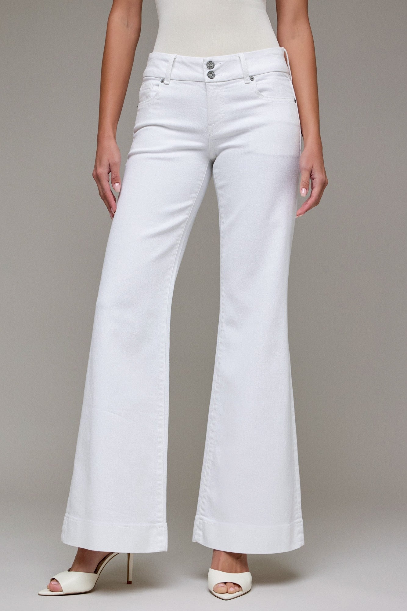 High-rise wide leg pants with full length silhouette styled with heels
