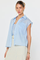 Two-piece set with a short sleeve button front top and matching striped pants styled together for a relaxed look