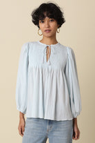 women's smocked blouse, women's peasant blouse, women's flowy blouse, boho style blouse women, women's lightweight blouse, women's long sleeve peasant top, women's relaxed fit blouse, women's everyday blouse, boutique boho blouse, women's feminine blouse, women's casual blouse, smocked yoke blouse women, women's airy blouse, effortless boho top