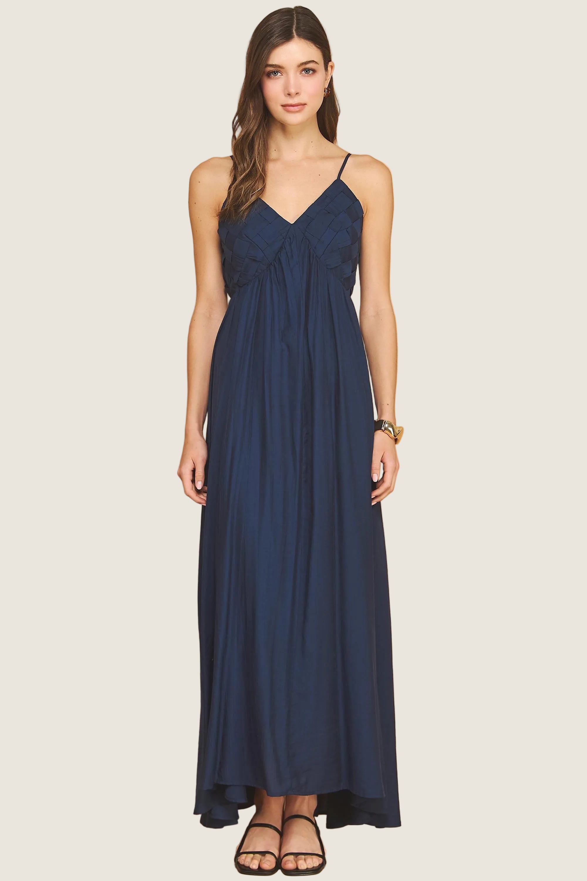Flowy maxi dress with V neckline, thin straps, and relaxed silhouette