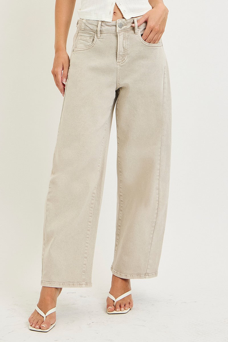 Model wearing high-rise wide-leg jeans with a relaxed fit and full-length silhouette.