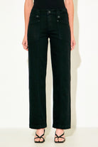 A model from the waist down wearing black wide-leg cropped jeans and black strappy sandals, standing against a plain off-white background.