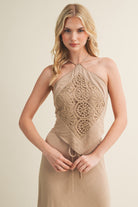 Halter top with lace detail and pointed hem silhouette