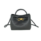 Smooth black faux leather finish

Braided handles and detachable crossbody strap

Gold knot hardware accent for a luxe touch

Structured design with roomy interior

Versatile for work, travel, or everyday wea