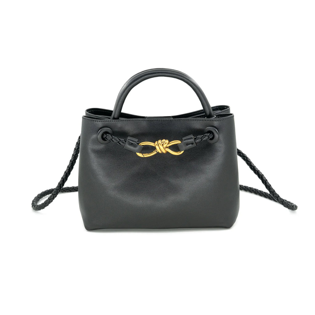 Smooth black faux leather finish

Braided handles and detachable crossbody strap

Gold knot hardware accent for a luxe touch

Structured design with roomy interior

Versatile for work, travel, or everyday wea