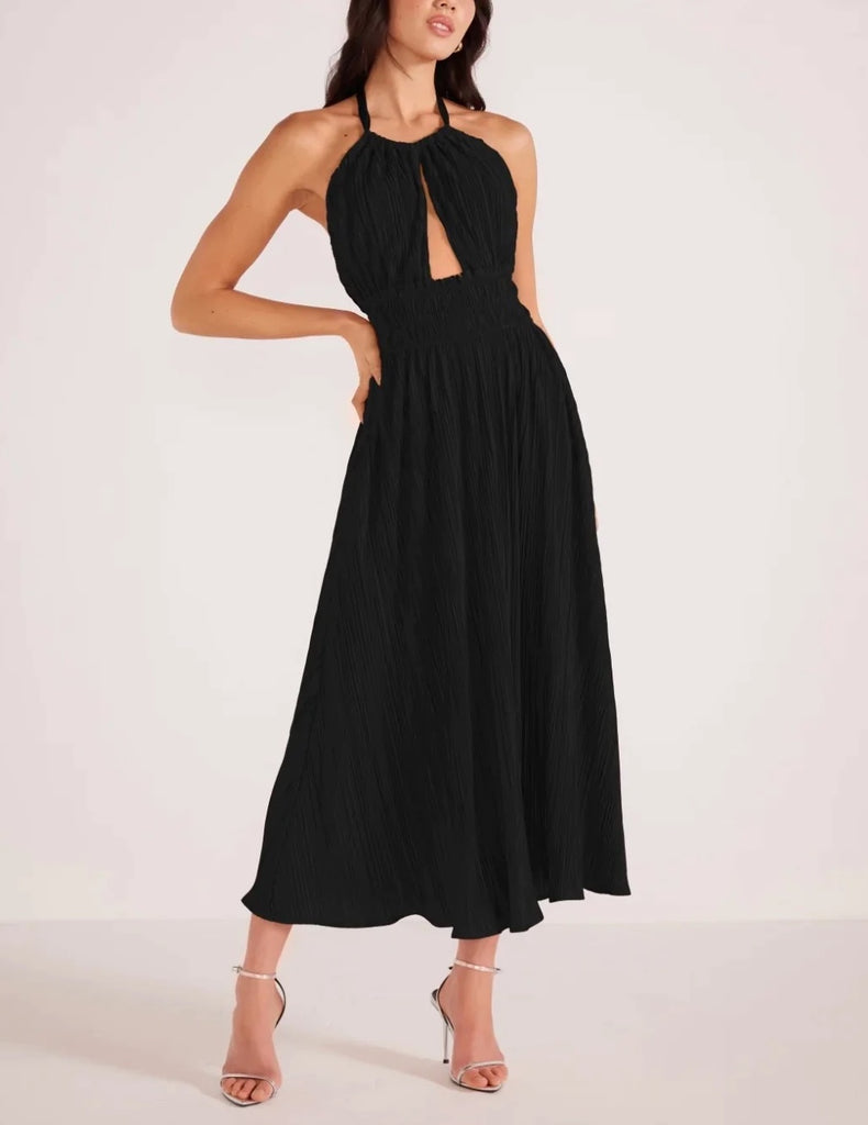 Gwen Halter Dress Black. This halter midi dress features a front cut out with a gathered waist and pleated design, the perfect little black dress to make a statement for any occasion.