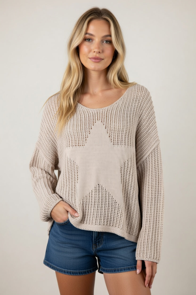 Lightweight open knit sweater with relaxed fit and star graphic detail styled with denim shorts