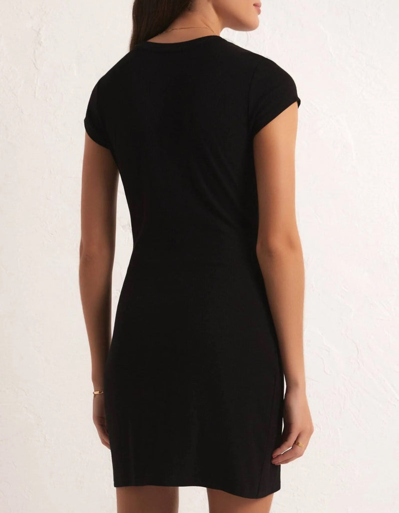 Z Supply Muse Mini Dress Black. Be a muse in the Muse Mini Dress! This black dress features a scooped neckline and shirring detail at the side for a flattering fit. Fully lined with mid-weight jersey, it's the perfect dress for any occasion.