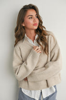lace up back sweater, neutral knit sweater women, modern classic sweater, layering sweater women, beige knit sweater, statement back sweater, women’s everyday knit, chic casual sweater