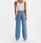Levi Baggy Dad Jean Medium Blue Wash. The kind of jean you might steal from your dad's closet but baggier. With a mid rise and straight leg, this pair is relaxed yet flattering with extra room for a subtle edge.