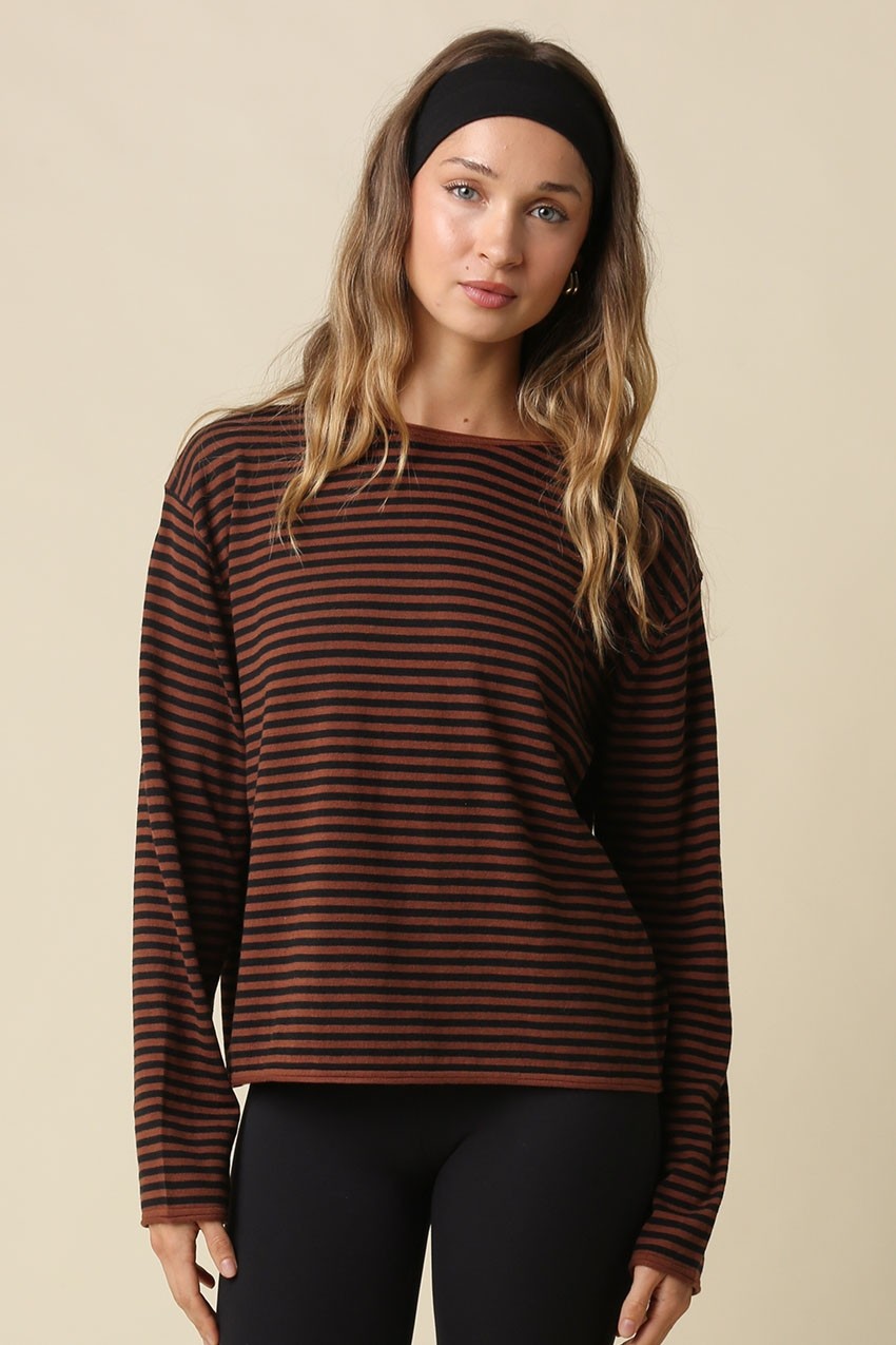  Striped knit crewneck top with long sleeves and a relaxed fit.