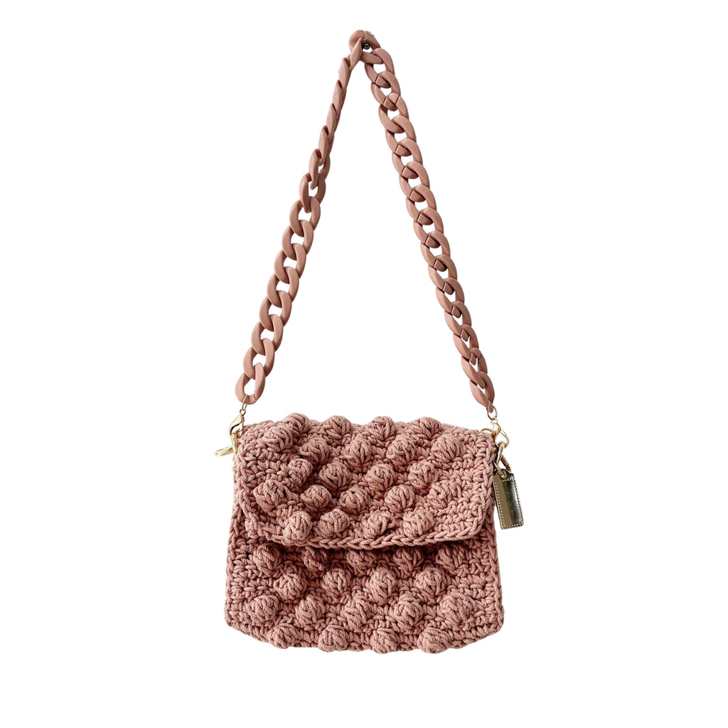 Crochet Bubble Bag Blush. Carry your essentials in style! Featuring a playful crochet bubble design and a chunky matte chain in a bold color drench this shoulder bag is a must-have for any fashionista.