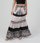 Tiered maxi skirt with mixed print design and lace trim detailing, styled with a cropped tank top.