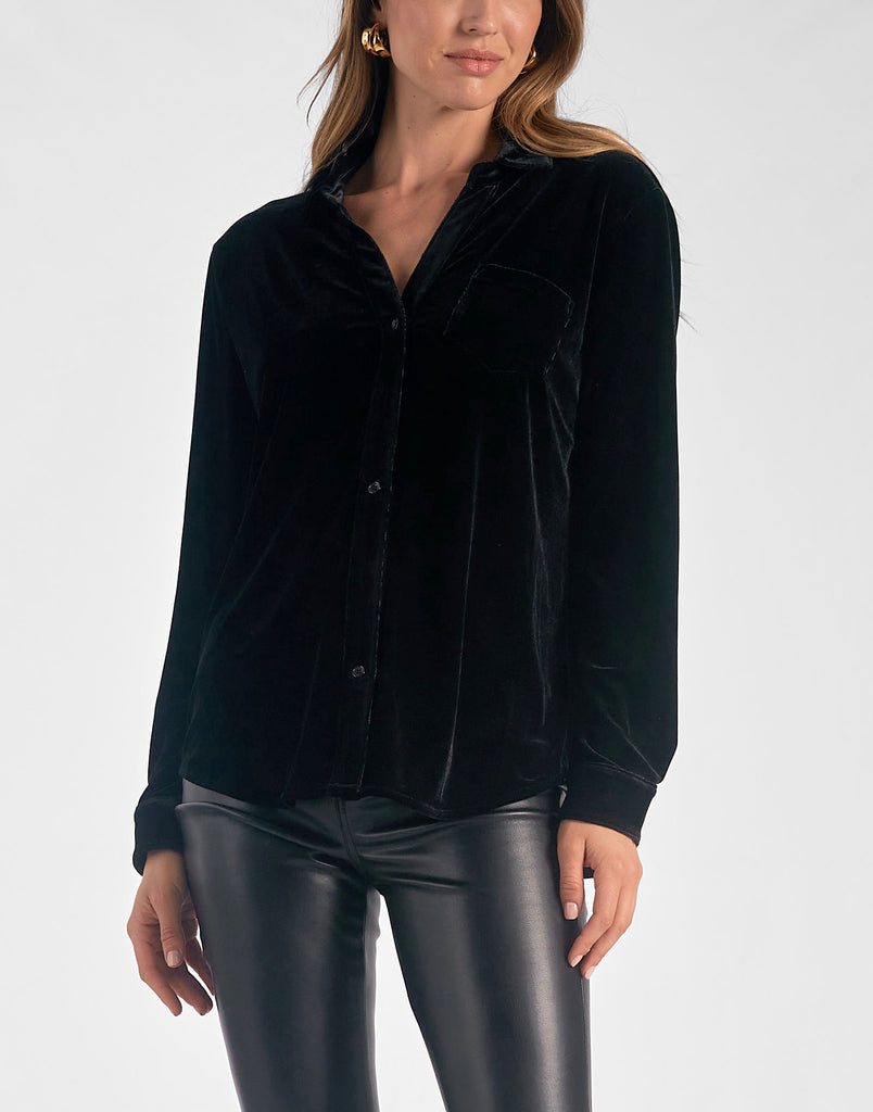 Elan Velvet Button Down Black. This velvet button down top is the perfect top to throw on for any occasion, dress it down with jeans or up with leather leggings and heels.