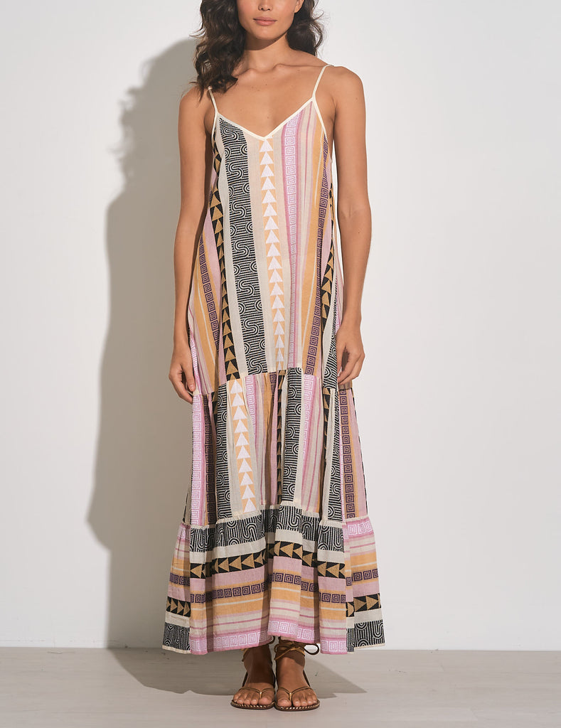 Elan Printed Maxi Dress Tan Multi. This printed maxi dress features a v-neckline, a tiered design and adjustable straps, it's the perfect piece to pack for a warm getaway that you can wear day or night.