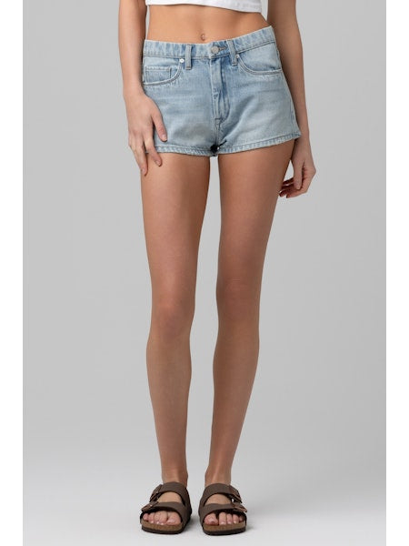 Mid-rise denim shorts with a relaxed fit styled with flat sandals