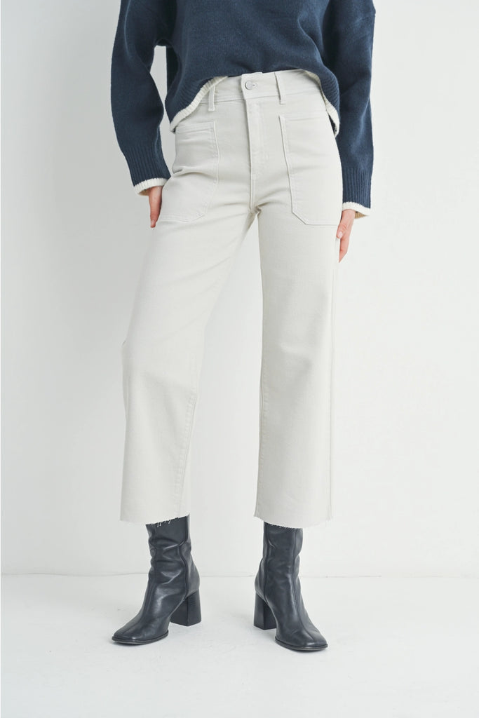 JBD Utility Wide Leg White. Wide leg jeans are everywhere, shouldn’t they be in your closet? Get with the times and make a statement in these wide leg Jeans. Bonus: big, roomy pockets that fit your phone and add just the right amount of drama.