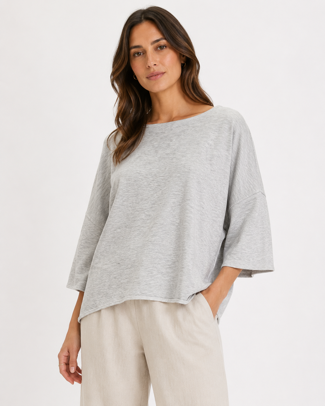 Relaxed fit lightweight knit top with wide sleeves and a drapey silhouette, styled with casual pants