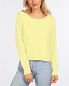 Eliza Front Seam Pullover Butter. This round neck pullover features a front seam and fitted design, the perfect lightweight everyday sweater to have in your closet for any time of year.